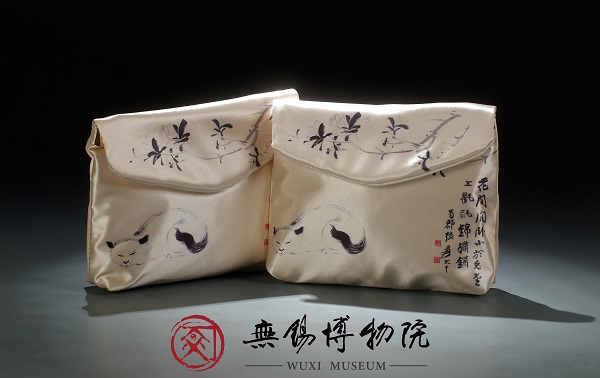 趣猫手拿包.jpg